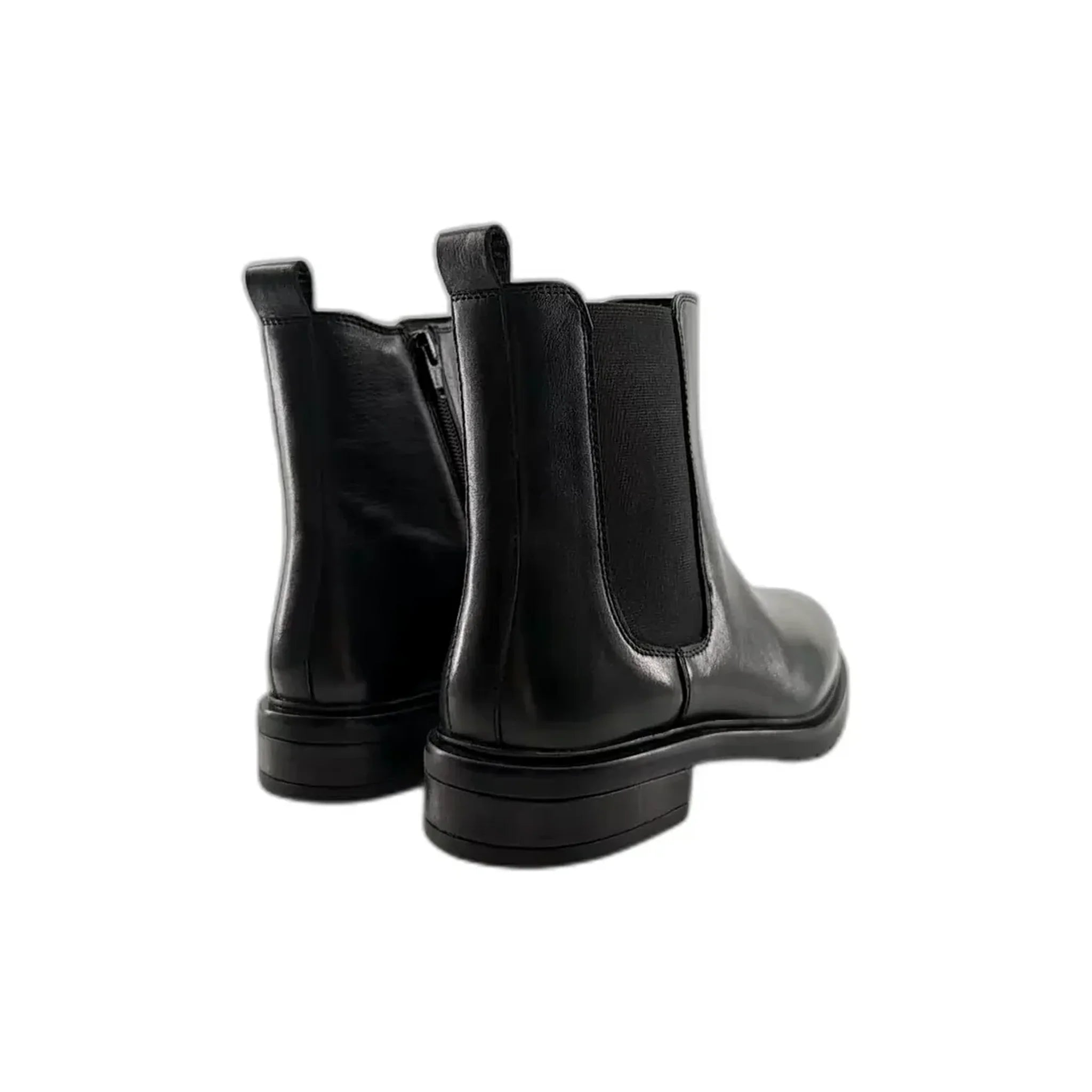 Pair of black leather Chelsea boots shown from rear angle on white background