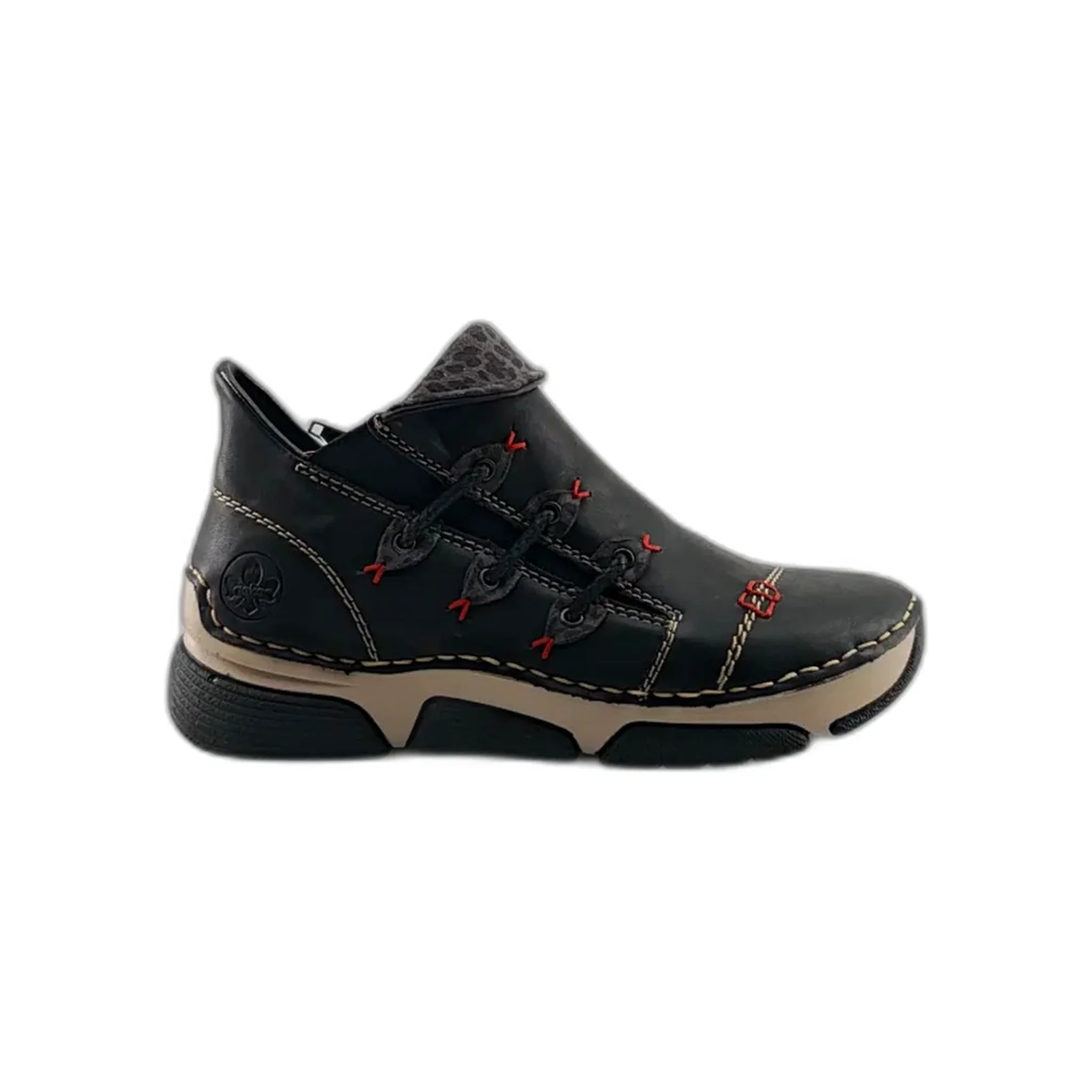 Black Rieker casual shoe with beige sole, red stitching accents, and textured collar detail