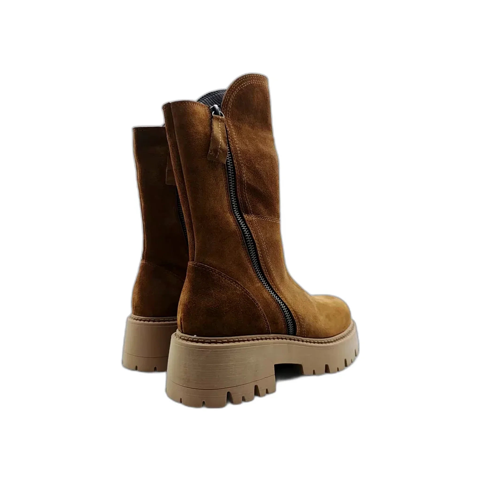 Pair of brown suede mid-calf Chelsea boots with thick beige rubber lug soles and side zippers