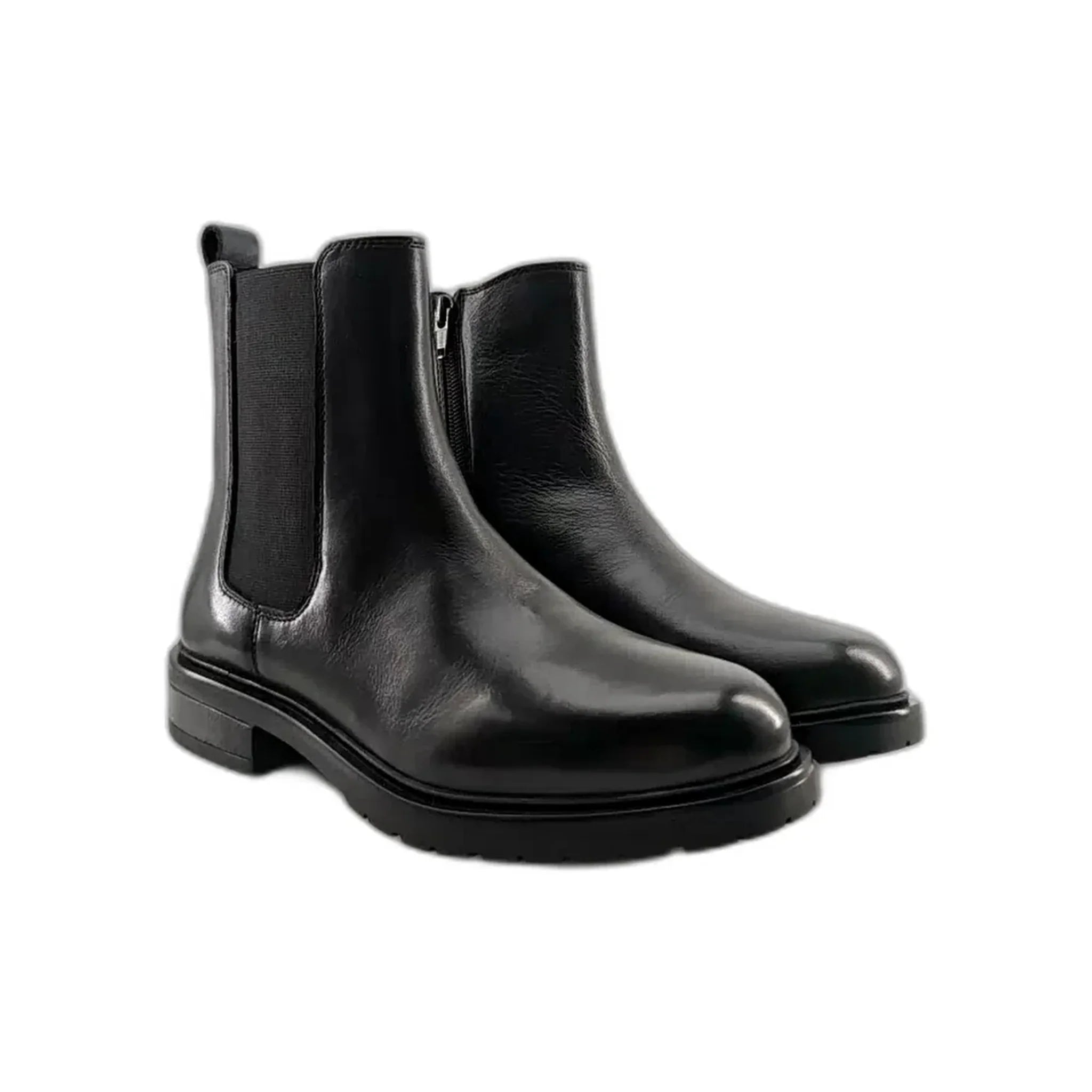 Pair of black leather Chelsea boots with elastic side panels and low heels on white background