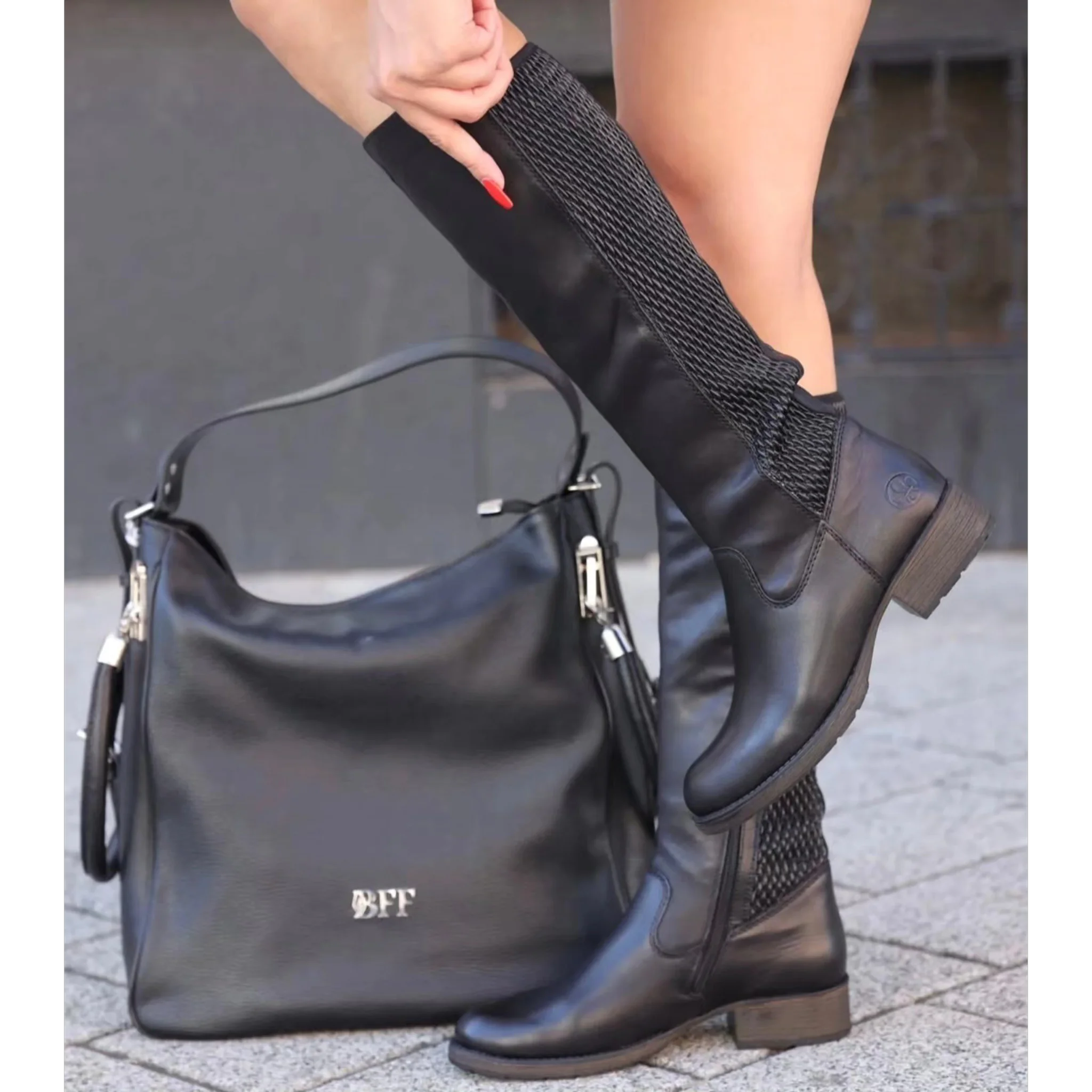Black high-heeled knee boots with zip and knitted detail paired with black leather BFF handbag